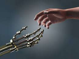 picture of a human hand and a robot hand working with a real person