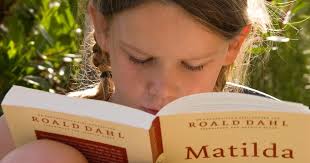 Famous Authors Series – Roald Dahl photo of girl reading Matilda