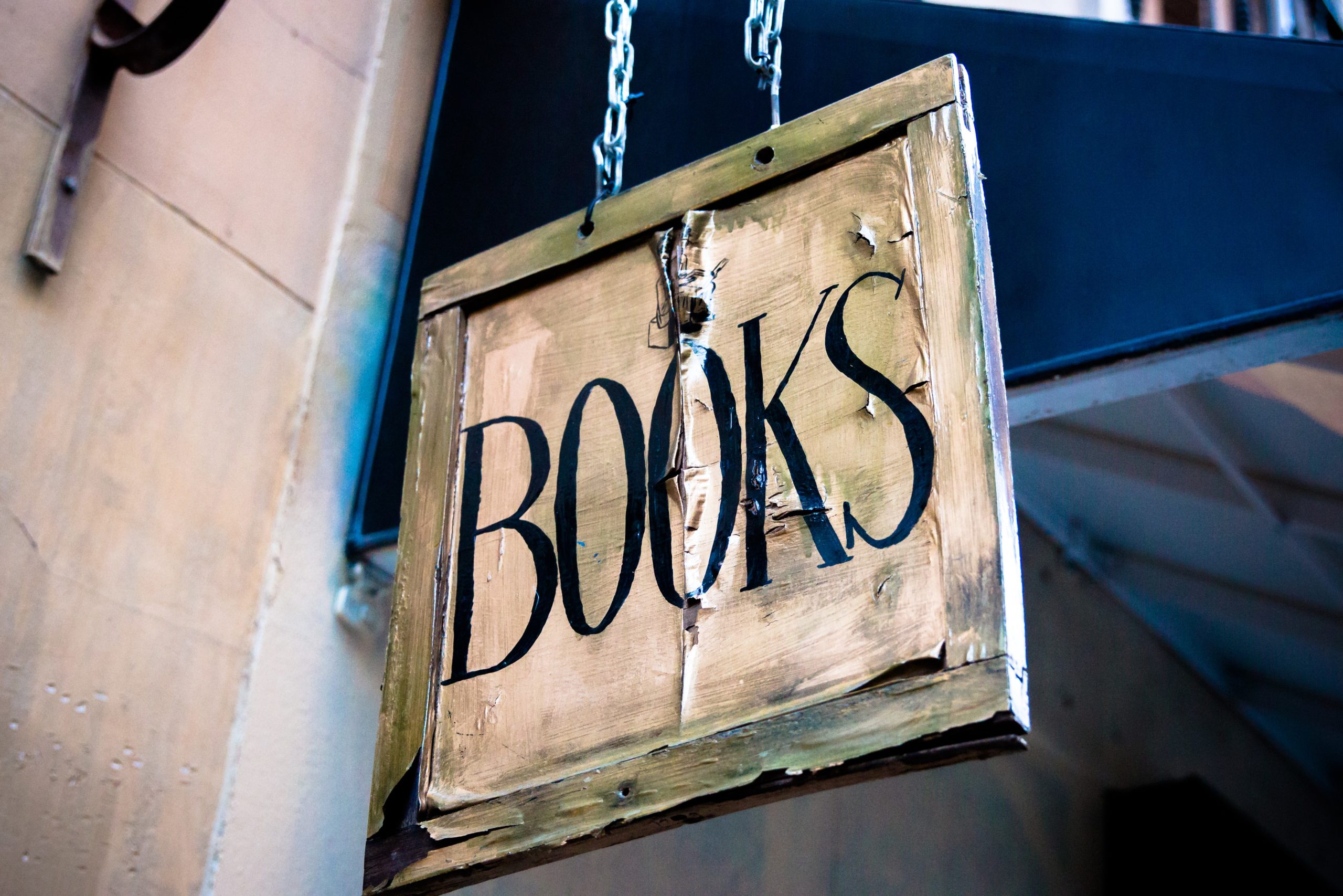 old-fashioned sign saying books in a madrid bookstore for post I want to write a book but