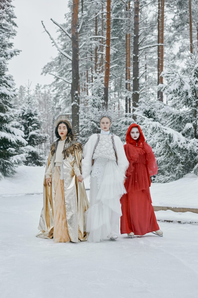 three women in costume in snowscape
