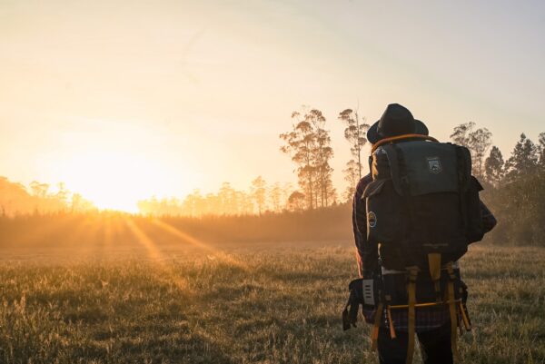 Backpacker looking at sunset - When is the Right Time to Introduce Side Stories and New Ideas?