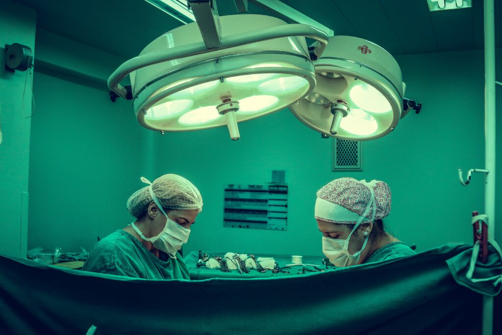 Surgeons and doctors performing an operation - How (And Why) Too Much Narration Kills Your Manuscript